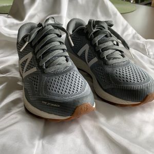 Lace up Gray athletic shoes.